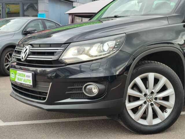 Чорний Фольксваген Тігуан, об'ємом двигуна 2 л та пробігом 150 тис. км за 18799 $, фото 2 на Automoto.ua