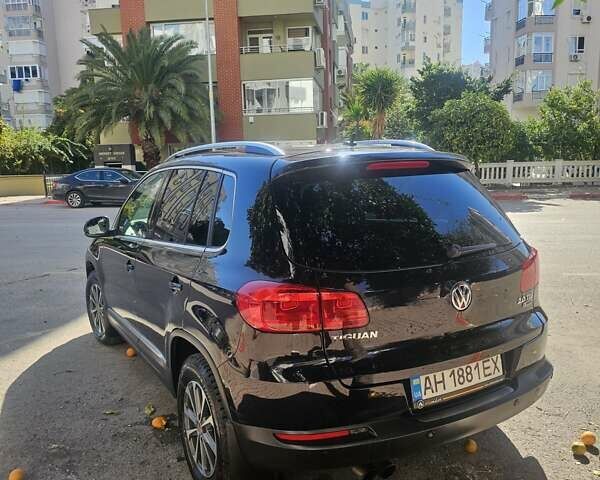 Черный Фольксваген Тигуан, объемом двигателя 2 л и пробегом 201 тыс. км за 14000 $, фото 3 на Automoto.ua