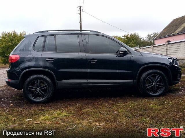 Чорний Фольксваген Тігуан, об'ємом двигуна 2 л та пробігом 145 тис. км за 11500 $, фото 3 на Automoto.ua