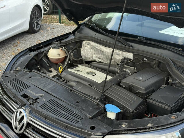 Чорний Фольксваген Тігуан, об'ємом двигуна 2 л та пробігом 180 тис. км за 12600 $, фото 1 на Automoto.ua