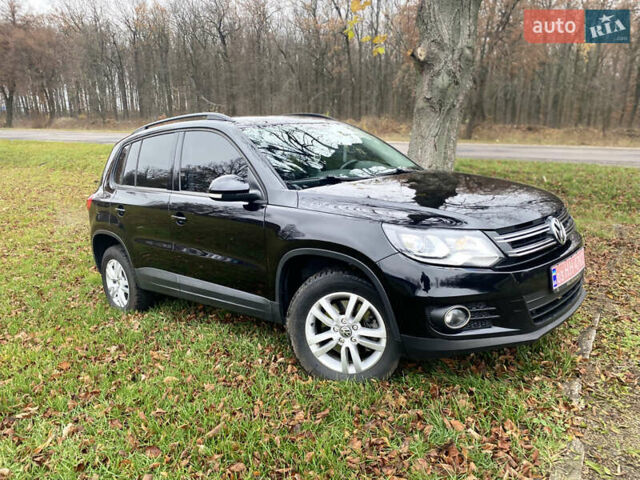 Чорний Фольксваген Тігуан, об'ємом двигуна 1.98 л та пробігом 124 тис. км за 13600 $, фото 1 на Automoto.ua