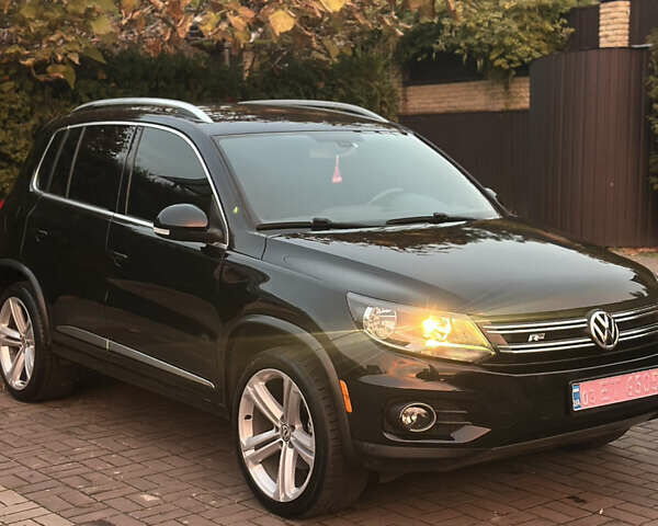 Чорний Фольксваген Тігуан, об'ємом двигуна 2 л та пробігом 207 тис. км за 14200 $, фото 1 на Automoto.ua