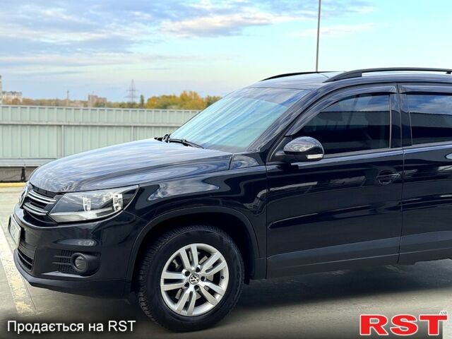 Чорний Фольксваген Тігуан, об'ємом двигуна 2 л та пробігом 184 тис. км за 12450 $, фото 1 на Automoto.ua