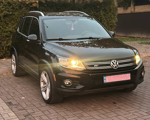 Чорний Фольксваген Тігуан, об'ємом двигуна 2 л та пробігом 207 тис. км за 14200 $, фото 2 на Automoto.ua