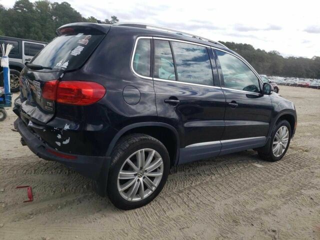 Чорний Фольксваген Тігуан, об'ємом двигуна 2 л та пробігом 64 тис. км за 1200 $, фото 2 на Automoto.ua