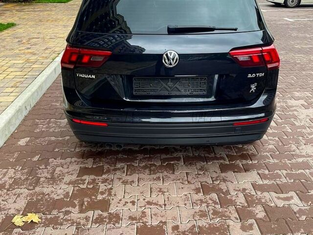 Чорний Фольксваген Тігуан, об'ємом двигуна 2 л та пробігом 167 тис. км за 25500 $, фото 2 на Automoto.ua