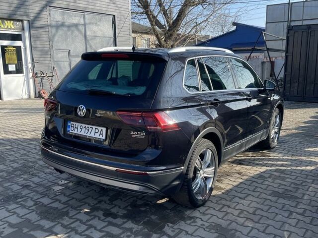 Черный Фольксваген Тигуан, объемом двигателя 2 л и пробегом 225 тыс. км за 24000 $, фото 4 на Automoto.ua