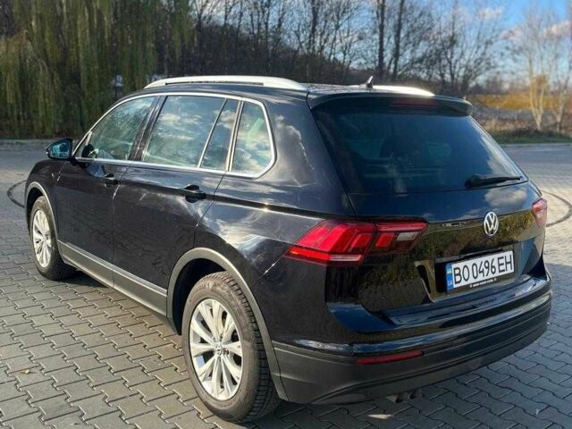 Черный Фольксваген Тигуан, объемом двигателя 2 л и пробегом 300 тыс. км за 17000 $, фото 1 на Automoto.ua