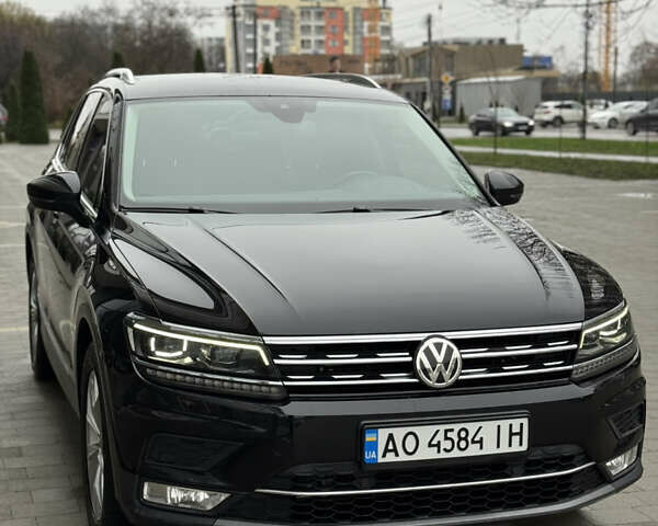 Черный Фольксваген Тигуан, объемом двигателя 2 л и пробегом 209 тыс. км за 23800 $, фото 2 на Automoto.ua