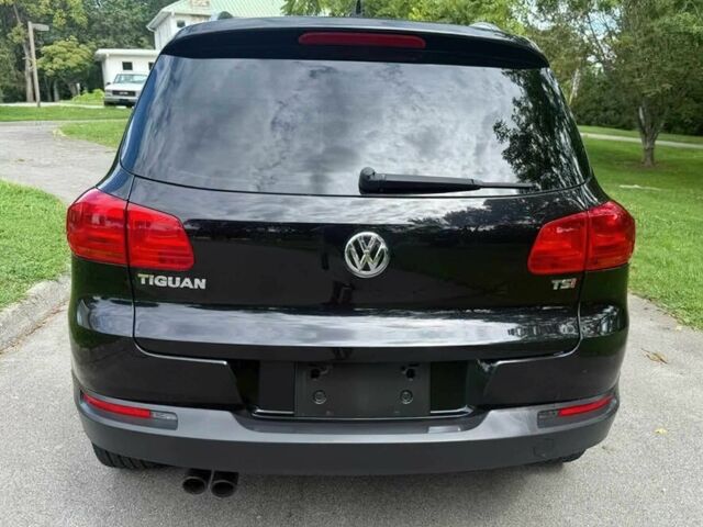 Чорний Фольксваген Тігуан, об'ємом двигуна 2 л та пробігом 52 тис. км за 3200 $, фото 4 на Automoto.ua