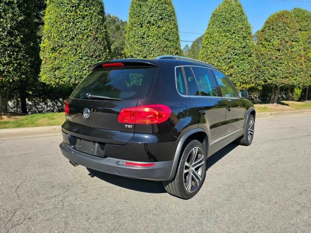 Черный Фольксваген Тигуан, объемом двигателя 2 л и пробегом 57 тыс. км за 11300 $, фото 2 на Automoto.ua