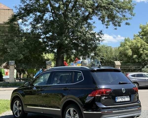 Черный Фольксваген Тигуан, объемом двигателя 2 л и пробегом 145 тыс. км за 19700 $, фото 1 на Automoto.ua