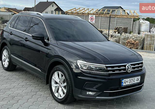 Черный Фольксваген Тигуан, объемом двигателя 1.97 л и пробегом 250 тыс. км за 23500 $, фото 1 на Automoto.ua