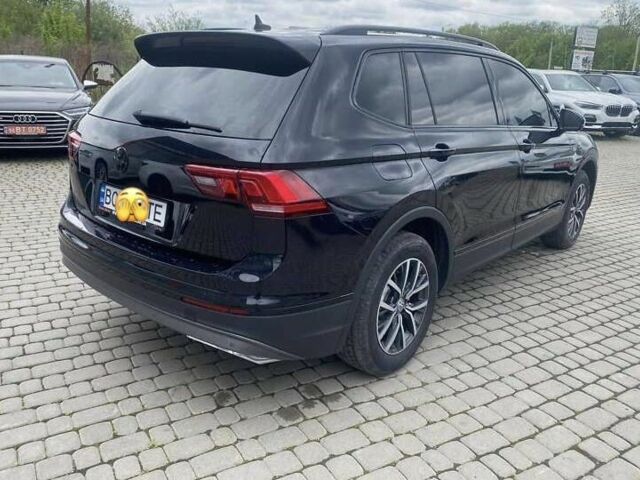 Чорний Фольксваген Тігуан, об'ємом двигуна 2 л та пробігом 131 тис. км за 18500 $, фото 2 на Automoto.ua