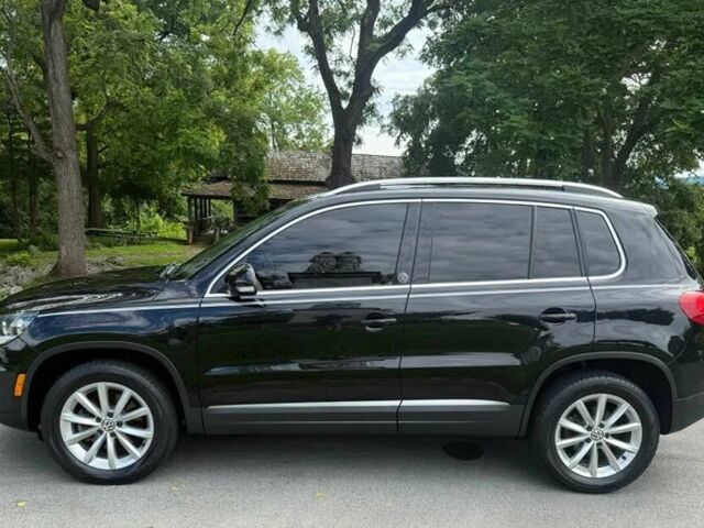 Чорний Фольксваген Тігуан, об'ємом двигуна 2 л та пробігом 52 тис. км за 3200 $, фото 3 на Automoto.ua