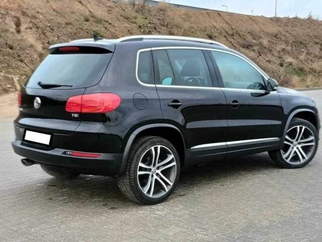 Чорний Фольксваген Тігуан, об'ємом двигуна 2 л та пробігом 82 тис. км за 10300 $, фото 2 на Automoto.ua