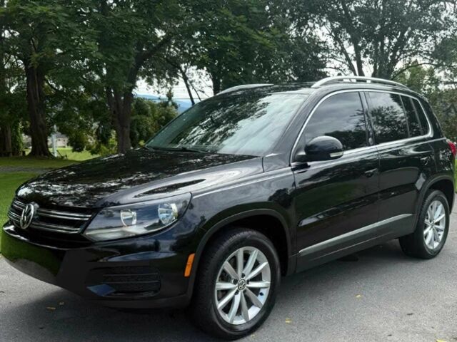Чорний Фольксваген Тігуан, об'ємом двигуна 2 л та пробігом 52 тис. км за 3200 $, фото 2 на Automoto.ua