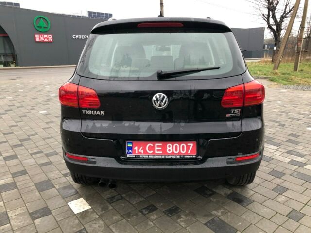 Чорний Фольксваген Тігуан, об'ємом двигуна 2 л та пробігом 187 тис. км за 10900 $, фото 1 на Automoto.ua