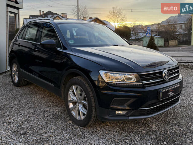 Чорний Фольксваген Тігуан, об'ємом двигуна 1.97 л та пробігом 243 тис. км за 23200 $, фото 1 на Automoto.ua