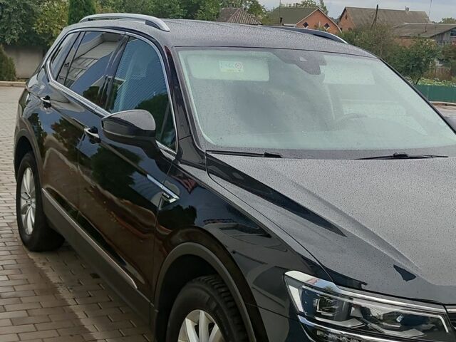 Чорний Фольксваген Тігуан, об'ємом двигуна 2 л та пробігом 260 тис. км за 24950 $, фото 1 на Automoto.ua