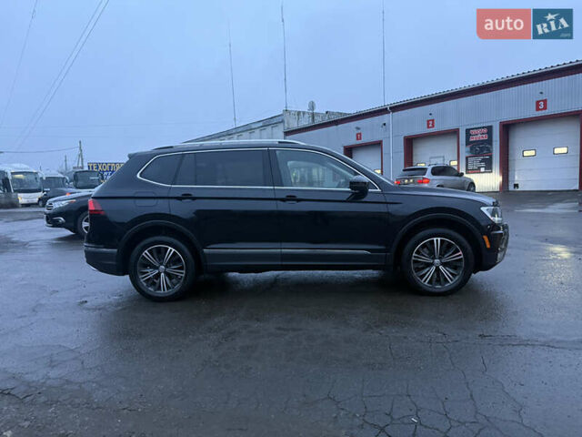 Чорний Фольксваген Тігуан, об'ємом двигуна 2 л та пробігом 162 тис. км за 18750 $, фото 2 на Automoto.ua