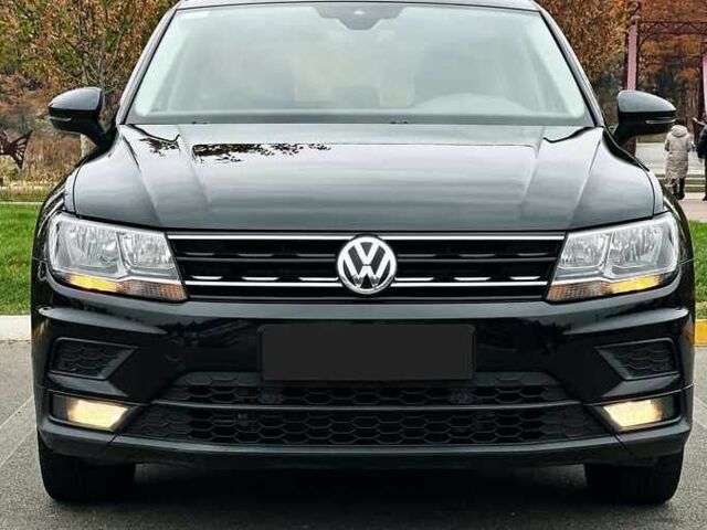 Чорний Фольксваген Тігуан, об'ємом двигуна 2 л та пробігом 150 тис. км за 23000 $, фото 1 на Automoto.ua
