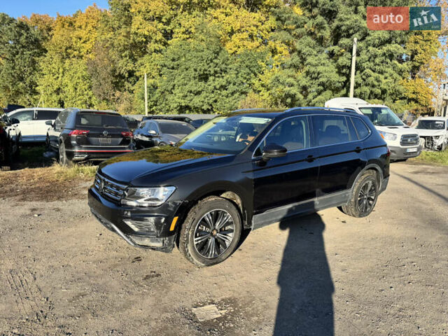 Черный Фольксваген Тигуан, объемом двигателя 2 л и пробегом 133 тыс. км за 11900 $, фото 1 на Automoto.ua