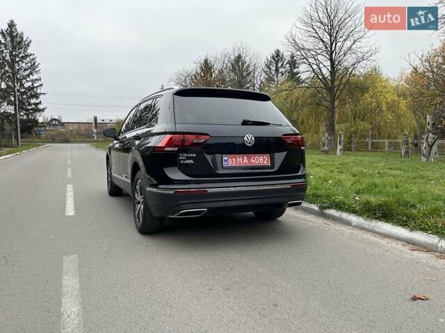 Чорний Фольксваген Тігуан, об'ємом двигуна 2 л та пробігом 124 тис. км за 19500 $, фото 104 на Automoto.ua