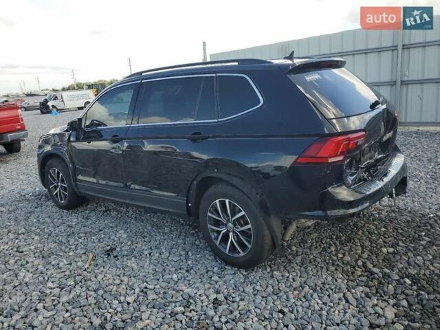 Черный Фольксваген Тигуан, объемом двигателя 2 л и пробегом 138 тыс. км за 12490 $, фото 1 на Automoto.ua