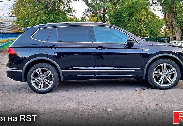 Чорний Фольксваген Тігуан, об'ємом двигуна 2 л та пробігом 237 тис. км за 27900 $, фото 3 на Automoto.ua