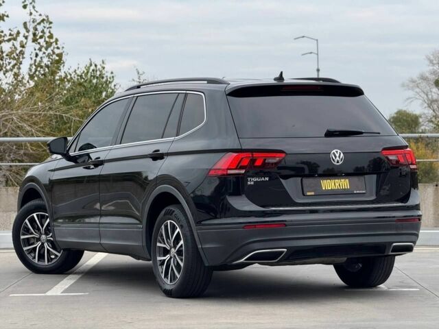 Чорний Фольксваген Тігуан, об'ємом двигуна 2 л та пробігом 117 тис. км за 19650 $, фото 5 на Automoto.ua