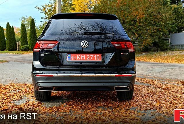 Черный Фольксваген Тигуан, объемом двигателя 2 л и пробегом 314 тыс. км за 15200 $, фото 3 на Automoto.ua