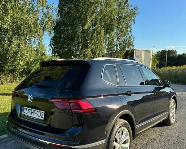 Чорний Фольксваген Тігуан, об'ємом двигуна 2 л та пробігом 223 тис. км за 27799 $, фото 2 на Automoto.ua