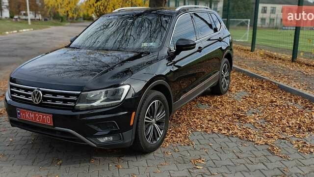 Чорний Фольксваген Тігуан, об'ємом двигуна 1.98 л та пробігом 314 тис. км за 15200 $, фото 1 на Automoto.ua