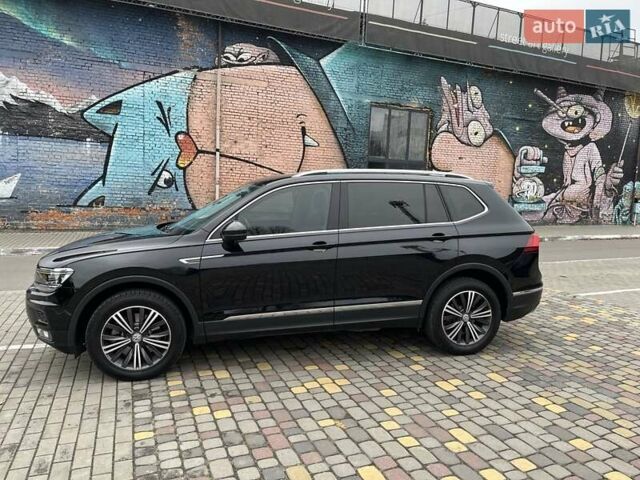 Чорний Фольксваген Тігуан, об'ємом двигуна 2 л та пробігом 124 тис. км за 19500 $, фото 3 на Automoto.ua