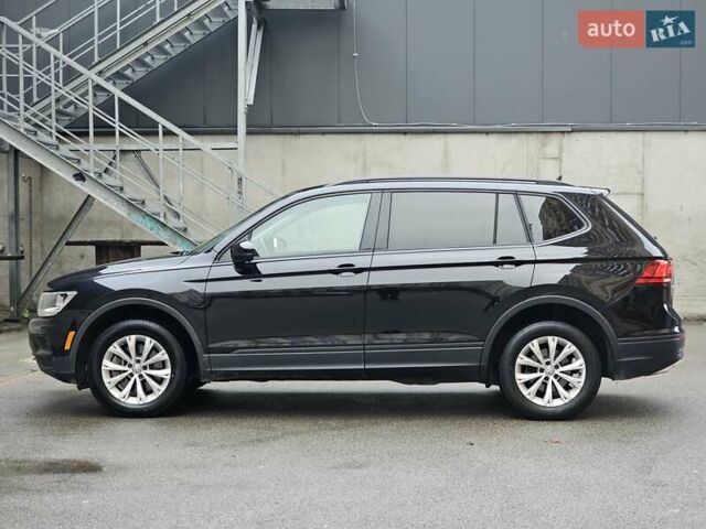 Черный Фольксваген Тигуан, объемом двигателя 2 л и пробегом 106 тыс. км за 18999 $, фото 1 на Automoto.ua