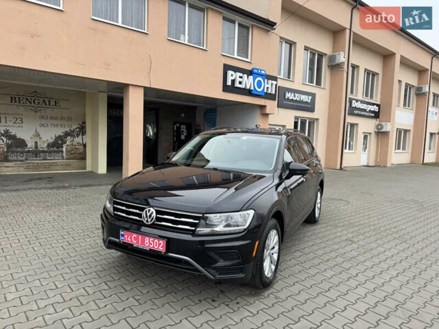 Чорний Фольксваген Тігуан, об'ємом двигуна 2 л та пробігом 232 тис. км за 14200 $, фото 2 на Automoto.ua