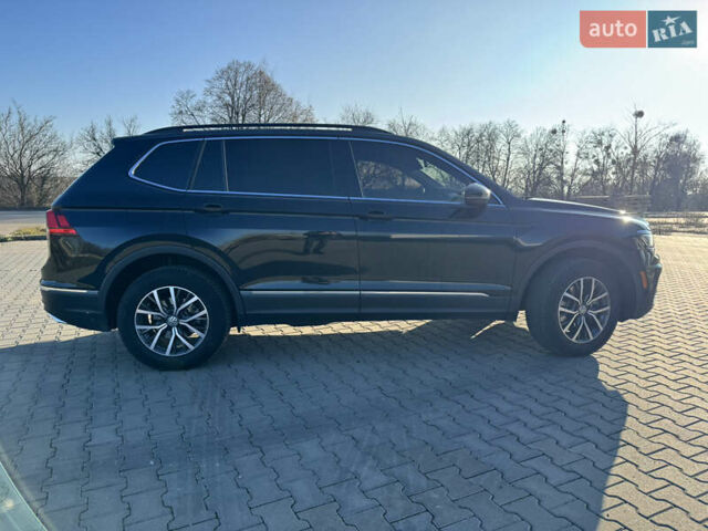 Черный Фольксваген Тигуан, объемом двигателя 2 л и пробегом 160 тыс. км за 21000 $, фото 2 на Automoto.ua