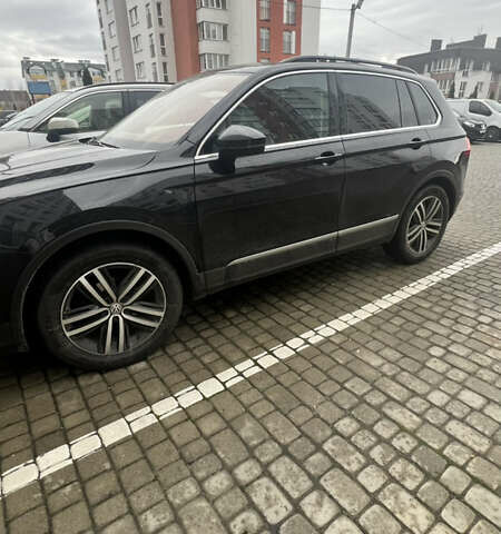 Черный Фольксваген Тигуан, объемом двигателя 1.97 л и пробегом 208 тыс. км за 27500 $, фото 1 на Automoto.ua