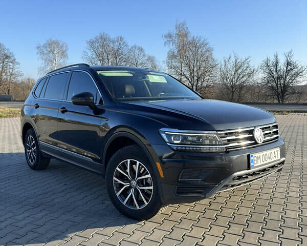 Черный Фольксваген Тигуан, объемом двигателя 2 л и пробегом 160 тыс. км за 21000 $, фото 1 на Automoto.ua