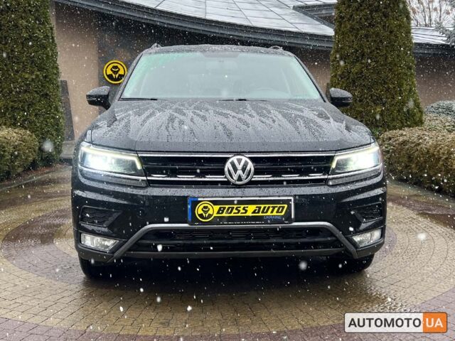 Чорний Фольксваген Тігуан, об'ємом двигуна 2 л та пробігом 37 тис. км за 25800 $, фото 1 на Automoto.ua