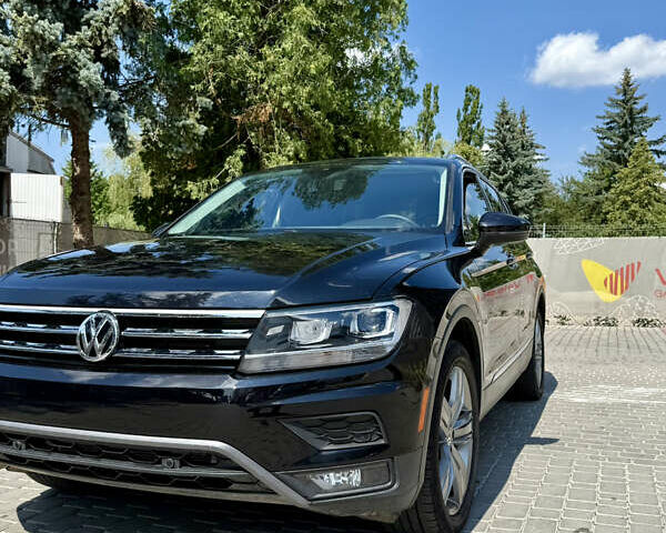 Черный Фольксваген Тигуан, объемом двигателя 1.98 л и пробегом 128 тыс. км за 23000 $, фото 1 на Automoto.ua