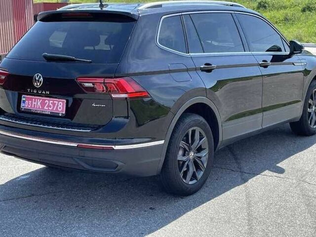 Чорний Фольксваген Тігуан, об'ємом двигуна 2 л та пробігом 54 тис. км за 21000 $, фото 2 на Automoto.ua