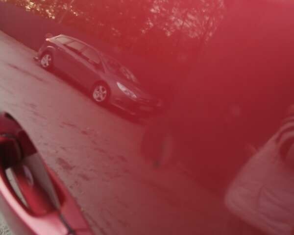 Красный Фольксваген Тигуан, объемом двигателя 2 л и пробегом 173 тыс. км за 12200 $, фото 6 на Automoto.ua