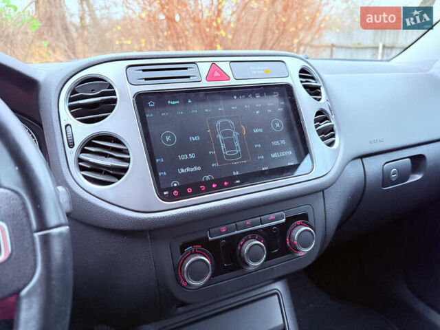 Червоний Фольксваген Тігуан, об'ємом двигуна 1.98 л та пробігом 218 тис. км за 8999 $, фото 12 на Automoto.ua