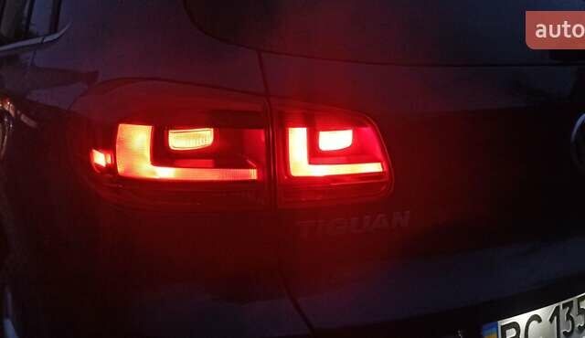 Червоний Фольксваген Тігуан, об'ємом двигуна 1.98 л та пробігом 182 тис. км за 12000 $, фото 14 на Automoto.ua