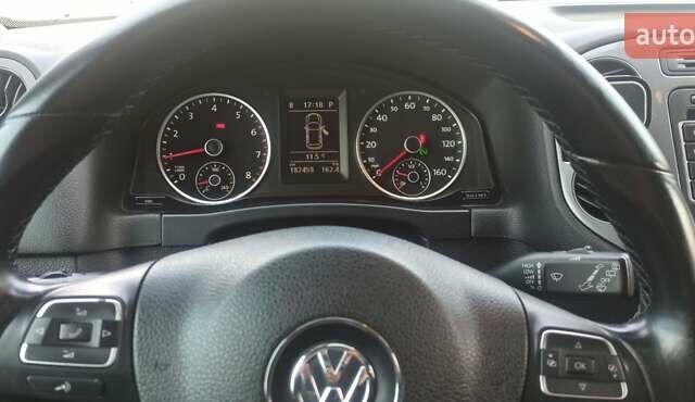 Червоний Фольксваген Тігуан, об'ємом двигуна 1.98 л та пробігом 182 тис. км за 12000 $, фото 1 на Automoto.ua