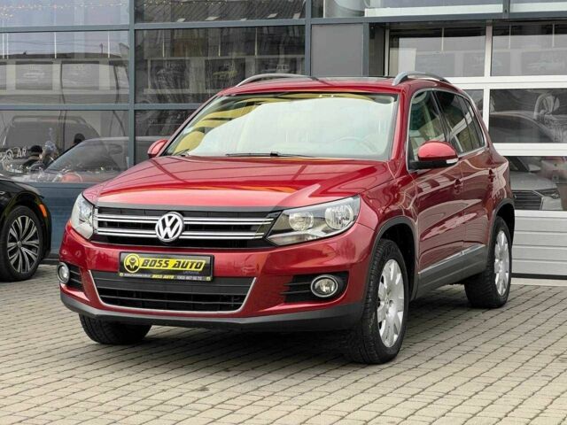 Червоний Фольксваген Тігуан, об'ємом двигуна 2 л та пробігом 120 тис. км за 11800 $, фото 2 на Automoto.ua