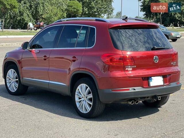 Червоний Фольксваген Тігуан, об'ємом двигуна 2 л та пробігом 91 тис. км за 13500 $, фото 5 на Automoto.ua