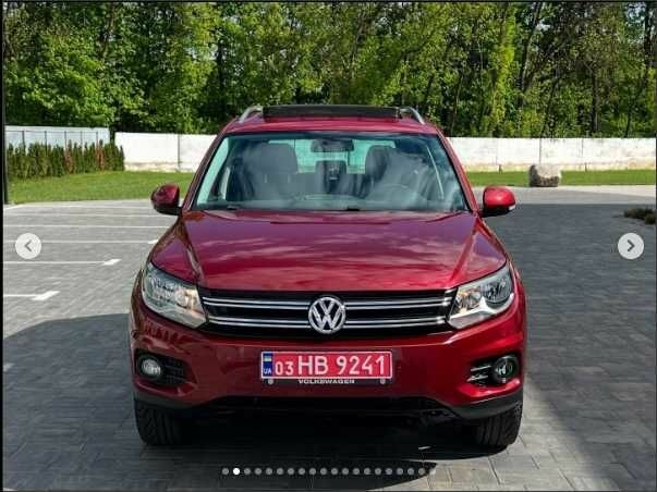 Красный Фольксваген Тигуан, объемом двигателя 2 л и пробегом 205 тыс. км за 12000 $, фото 1 на Automoto.ua